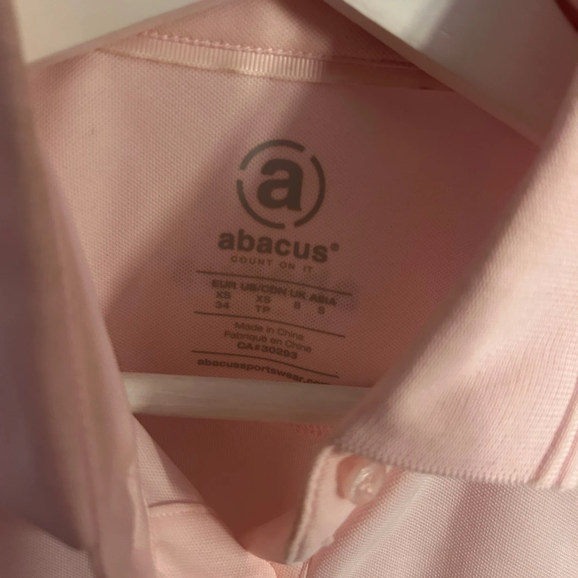 Rosa pikétröja från Abacus - 2