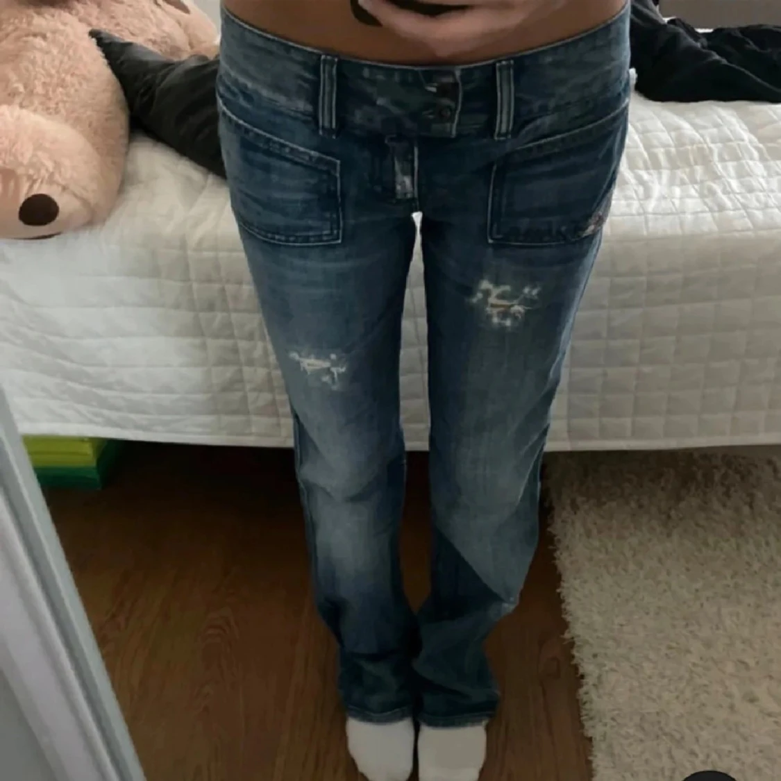 Blå diesel jeans med slitningar