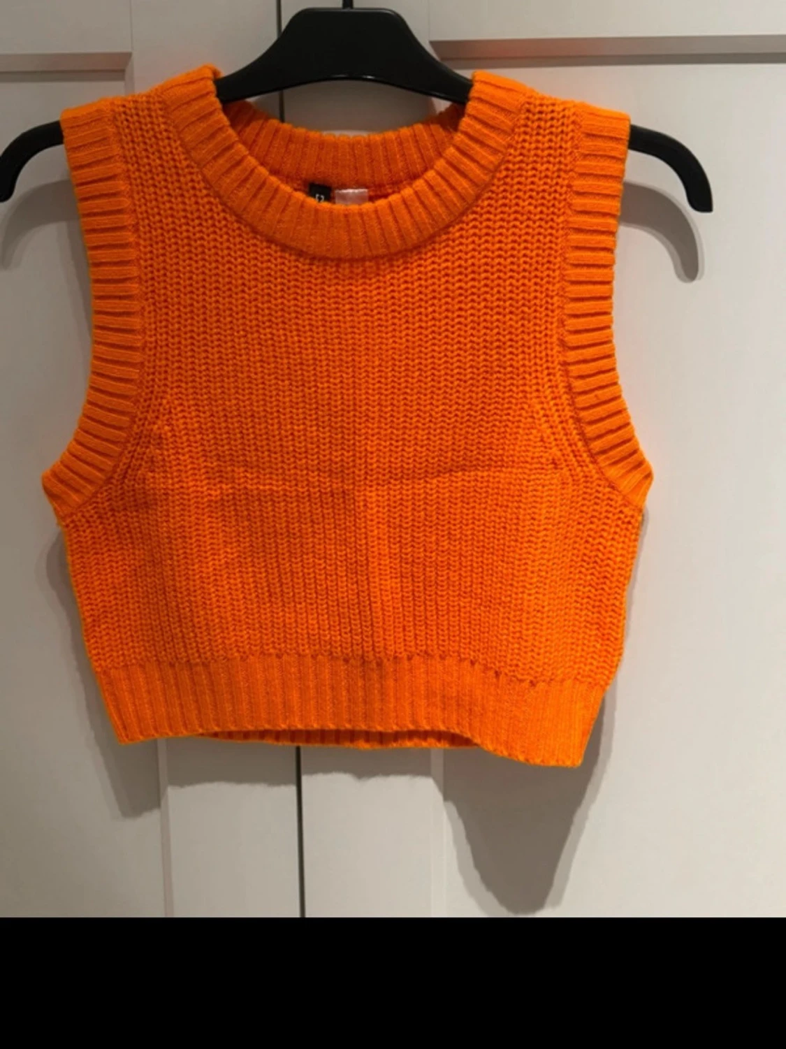 Orange stickad väst från Divided H&M