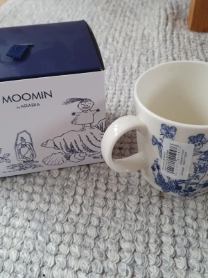 Muminmugg Havsbris Mumin  - Felfri mugg med etikett kvar. Originalkartong följer med. Säljer fler Muminmuggar så kika gärna på mina övriga annonser också. Packar mycket noggrant. 