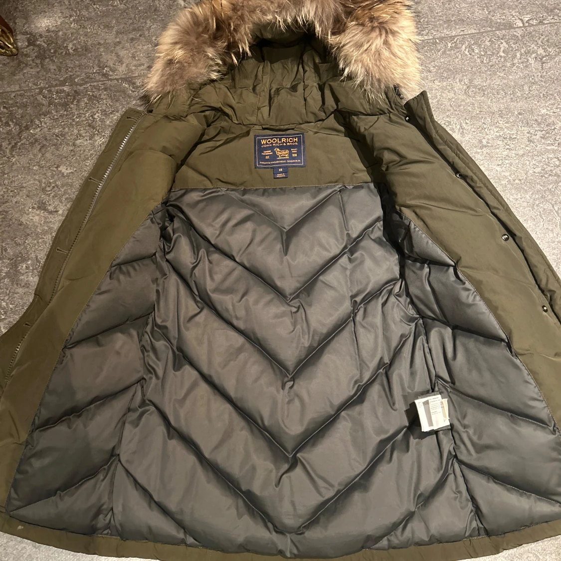 Olivgrön parkajacka från Woolrich - 90