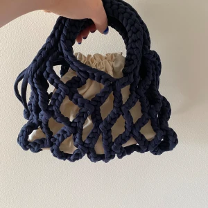 Handmade crochet bag  - Small handmade bag. Never been used. With a removable cotton bag inside. Perfect size for a night out or a day in the city. Dark navy blue.