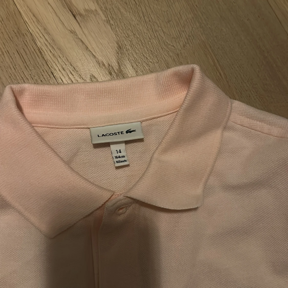 Ljusrosa pikétröja från Lacoste - 2