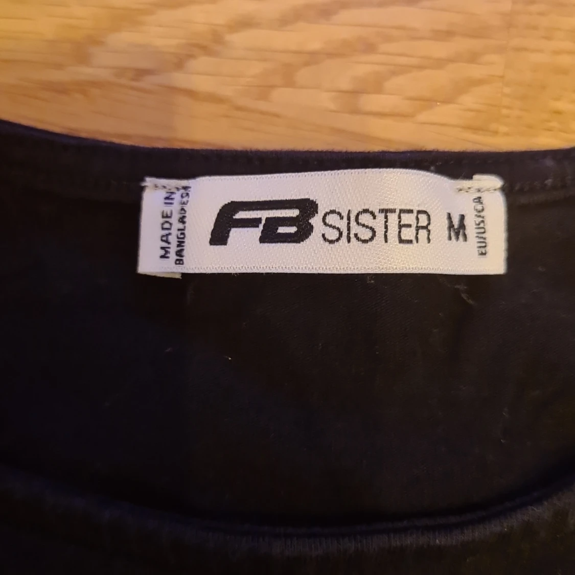 Svart linnetopp från FB Sister - 91