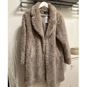 Kappa/Jacka - Kappa från KappAhl som bara har hängt i garderoben med etiketten.  