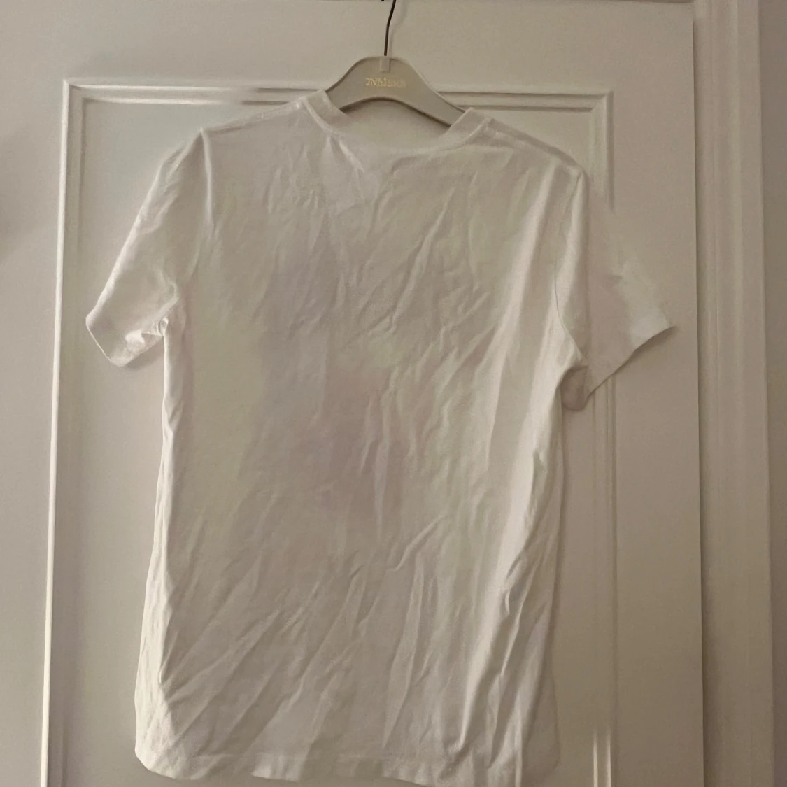 Vit t-shirt från Ganni  - 91