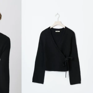 Svart omlottkofta - Aldrig använd har fortfarande lappen kvar, tröjan är slutsåld