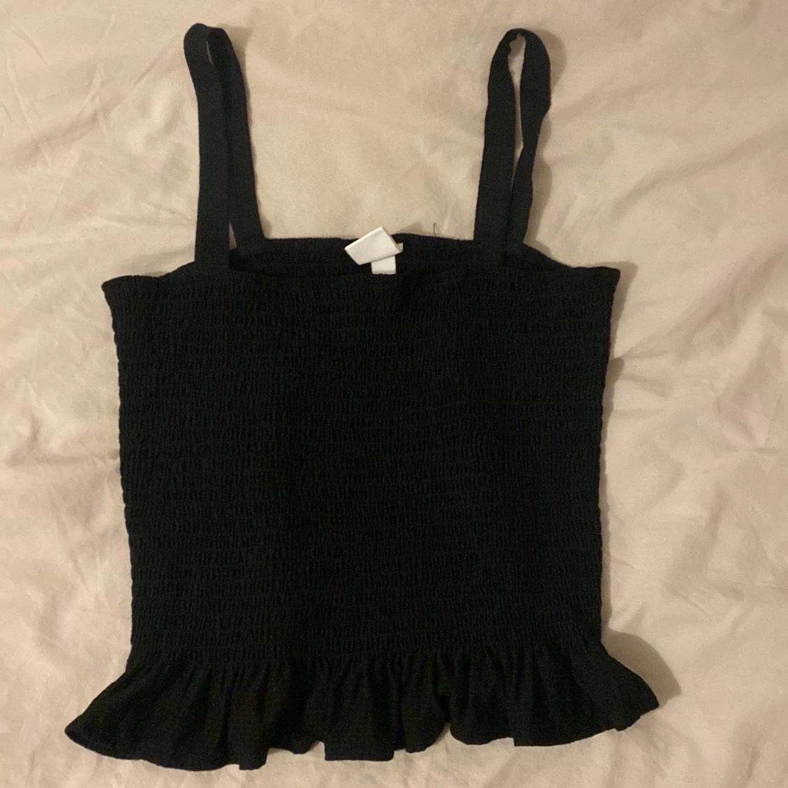 Svart ribbad topp från H&M