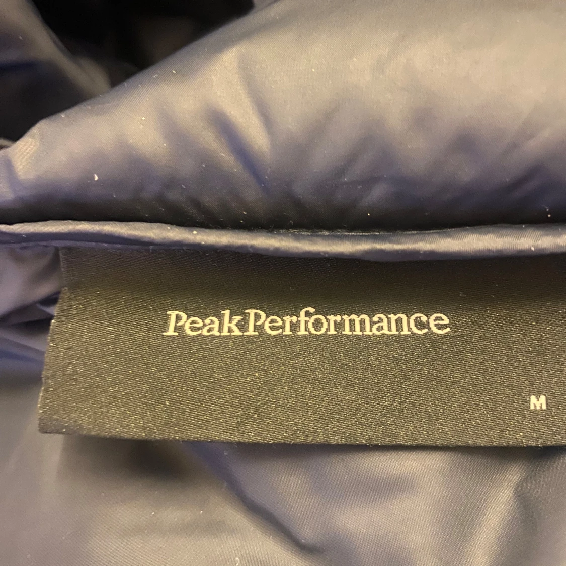 Blå dunjacka från Peak Performance - 92