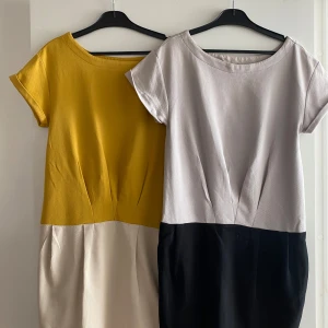 Klänningar - Två stilrena klänningar i kraftigare vävtmaterial. Välklädd och bekväm stretch. Rakmodell som sitter snävt över rumpan 