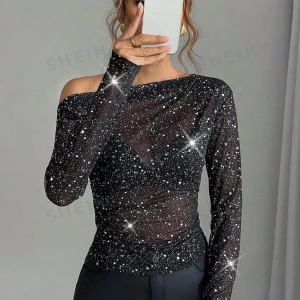 Glittrig topp  - Säljer denna fina topp då den var för liten för mig