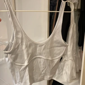 Topp - Ljus blå kort topp. 