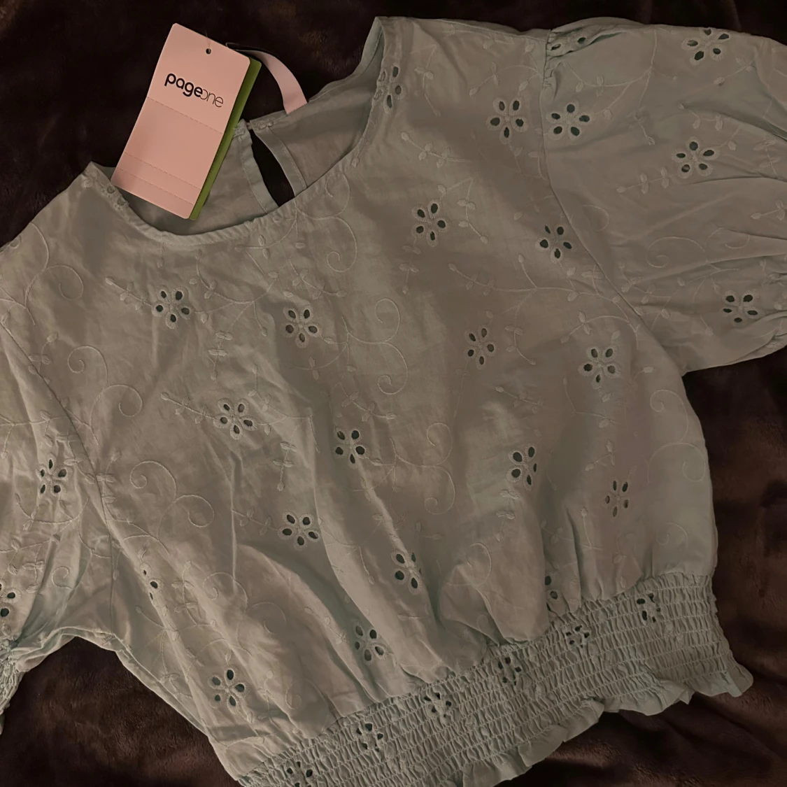 En blommig turkos blus  - 1