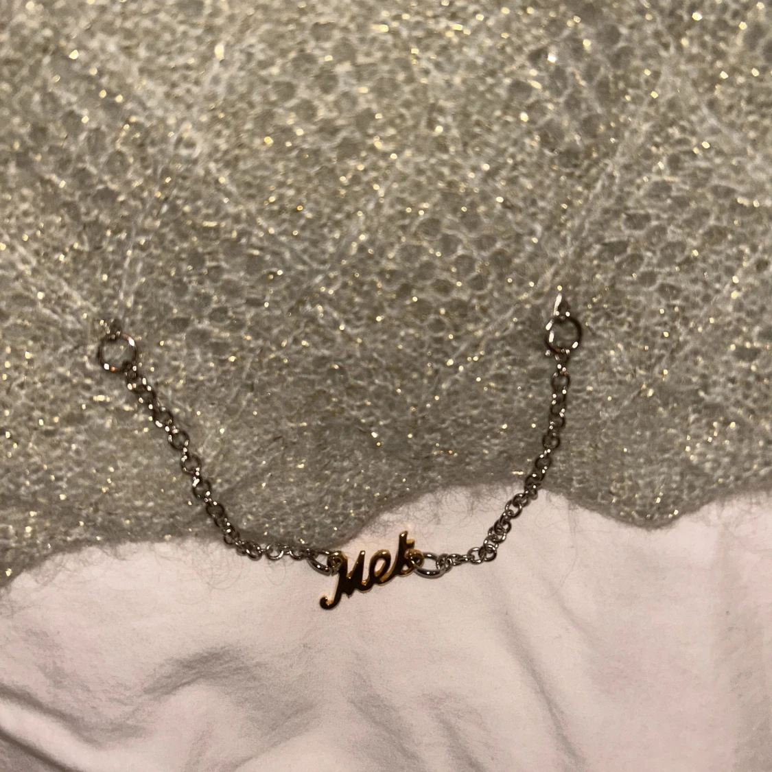 Glittrig stickad topp - 91