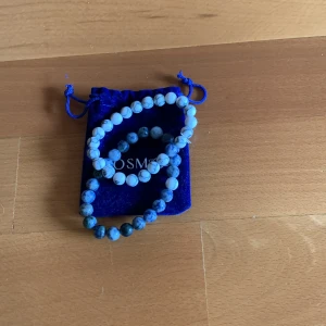 Cosmos armband  - Cosmos armband som är använda fåtal gånger 