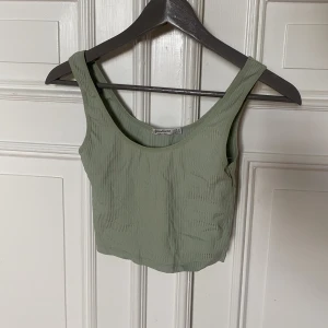 Linne - Ett grönt linne. Skulle kunna vara ett träningslinne 