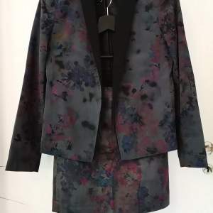 Mango blazer and short skirt with abstract floral pattern in grey, blue and pink. 