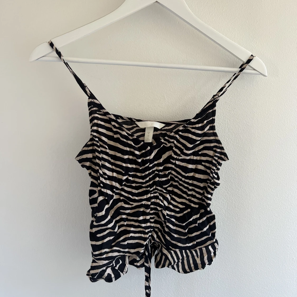 HM topp, med band i fram