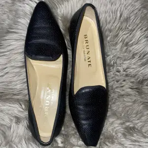 Classic Brunate Loafers (Original) - Real leather. Comfortable and Elegant. Good for pants, dresses, autumn and summer wear. Made in Italy. Colour: Black. Great condition. Size is custom 37,5 but I am a 38 and I can wear them easily.