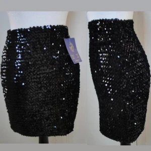 Mycket snygg svart paljett tub - (kan ej skicka fler bilder eller visa hur den ser ut på) kan användas som tubtopp eller kjol. storlek S. stretchig. möts i stockholm eller fraktar
