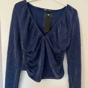 Blue top - Blue top with sparkles, new with tags, super cute for a night out!! Size XL new with tags never worn