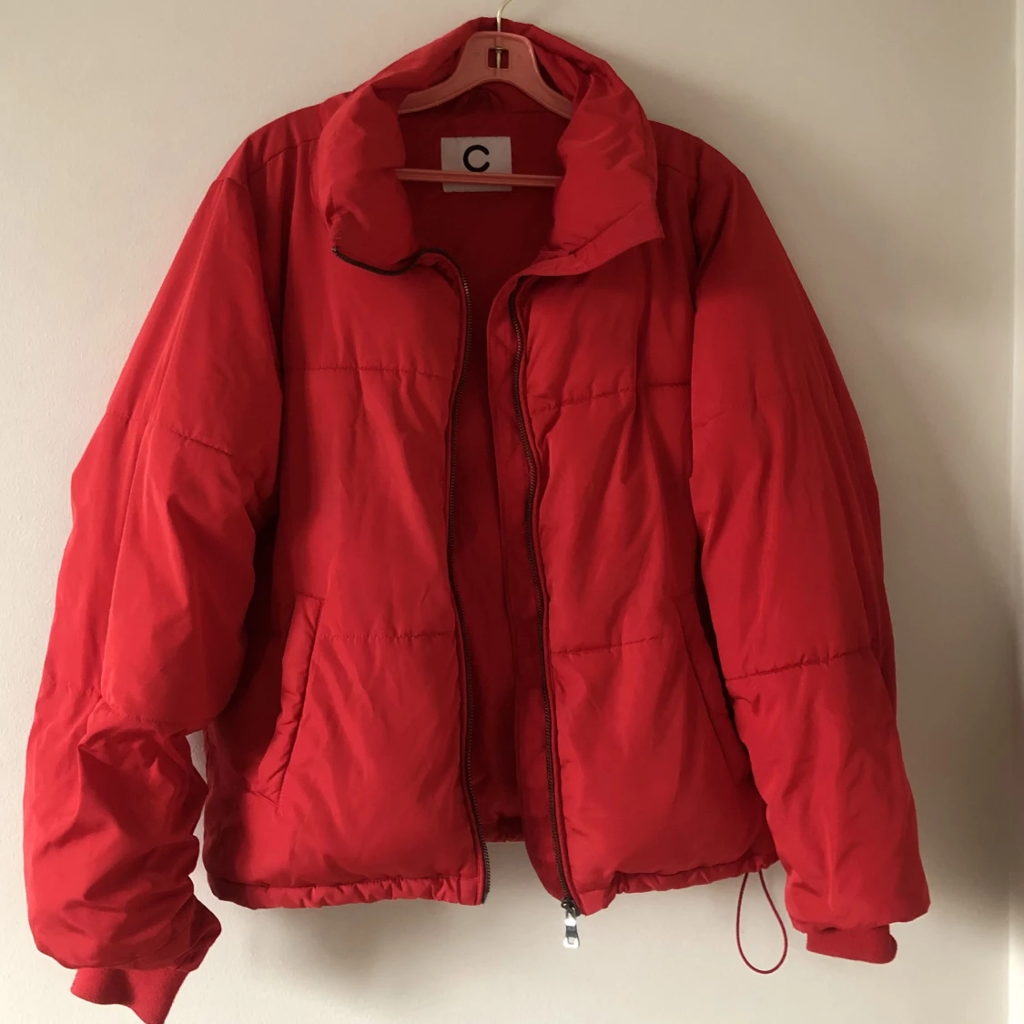 Red puffer coat