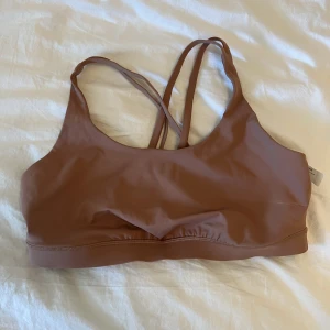 Lululemon sports bra - Dusty pink/clay color size 14, worn only to try on and then forgot to return 