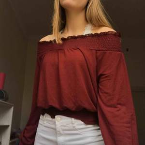 Maroon-red off the shoulder top from gina tricot. The neckline, bottom of sleeves, and bottom of the top are ruffled and the whole shirt is soft/ stretchy. It says it’s size S but could easily fit M as well💘