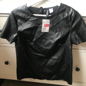 Oanvänd tröja - Oanvänd material läder