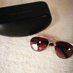  - Glod framed sunglasses. Come with the original leather box.
