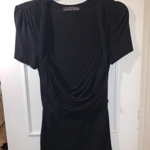 Topp - En topp i storlek L. Använd få gånger. Djur finns i hemmet.