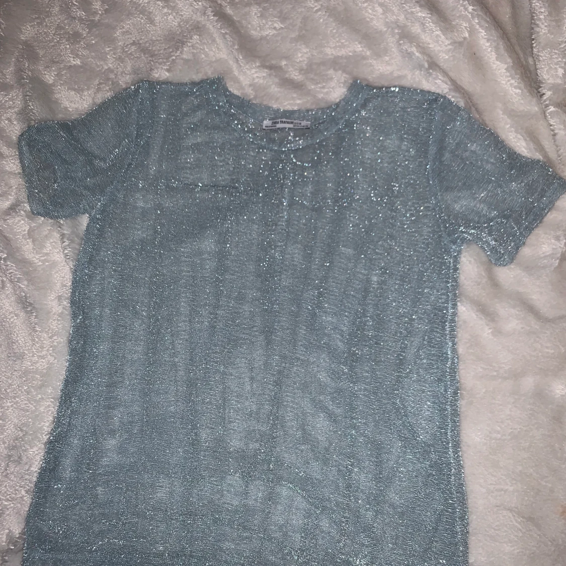 Glittrig genomskinlig fest topp