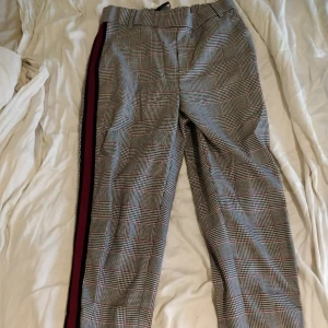  - Soft-looking comfortable trendy autumn trousers, gray-colored with a red stripe from ZARA. Selling then I bought the same in one size larger and forgot to return these. Totally unused with the price tag left!