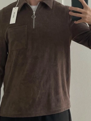 Half zip - Brothers frotté brun half zip. Storlek S. 