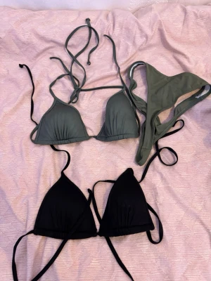  trekantsbikinis i  grönt - Säljer stilrena trekantsbikinis olivgrönt.