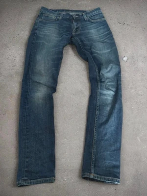 Nudie jeans washed denim - Snygga jeans med washed blå färg i storlek W29 L32