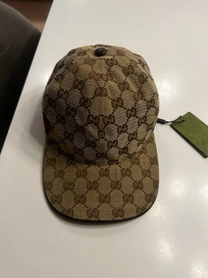 Beige gg keps - Beige GG keps, finns i S och M. Hör av er för minsta lilla