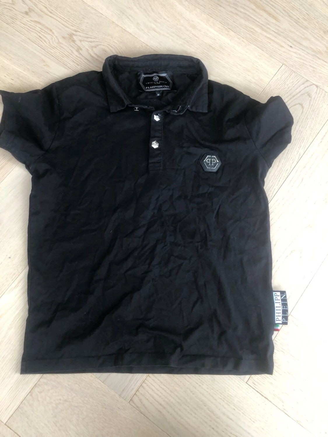 Svart polotopp från Philipp Plein