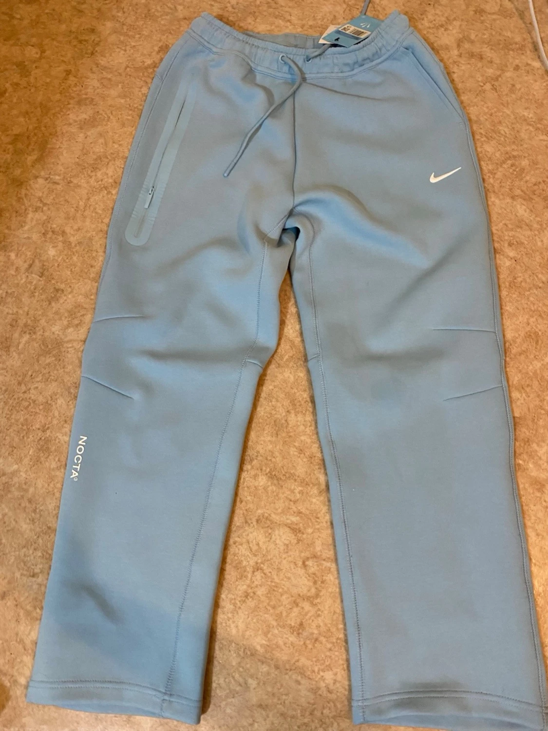 Nike NOCTA ljusblå mjukisbyxor