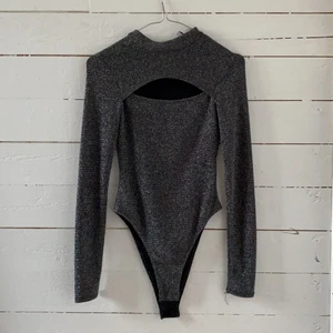 Glitter body - Glitter body från hm, aldrig andvänd, bra skick.