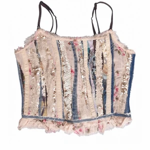 Unique corset top in denim  - Handmade patchwork- one of a kind. Made from fabrics such as and denim and sequins. In very good condition.
