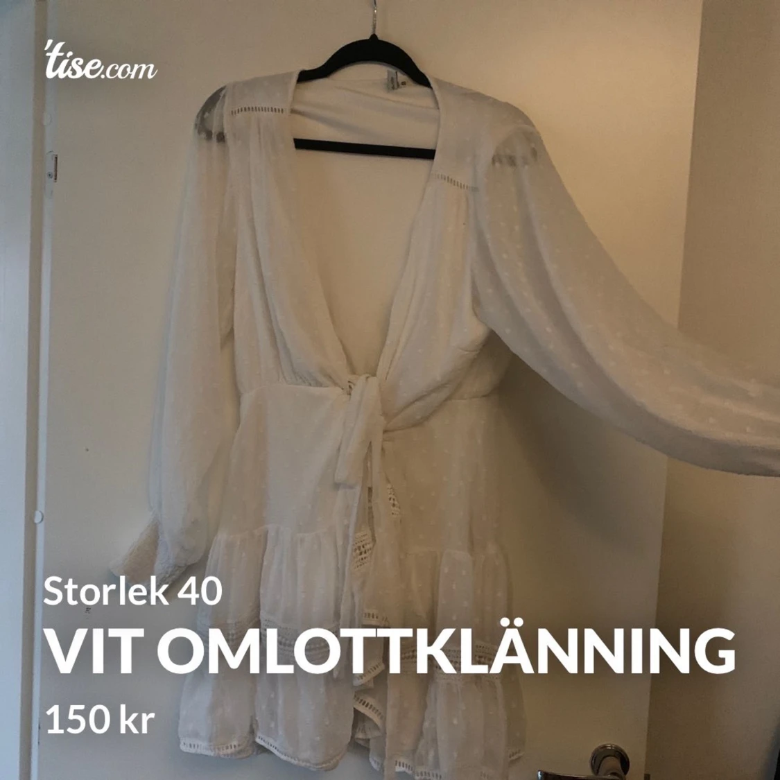 Vit omlottklänning i storlek 40