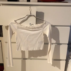 Topp  - En topp som går under axlarna 