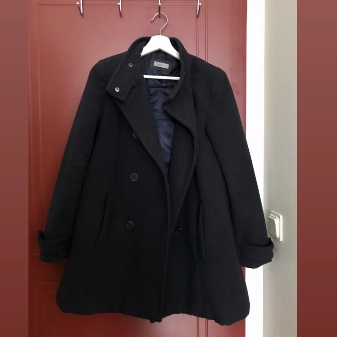 Mörkblå vinterkappa