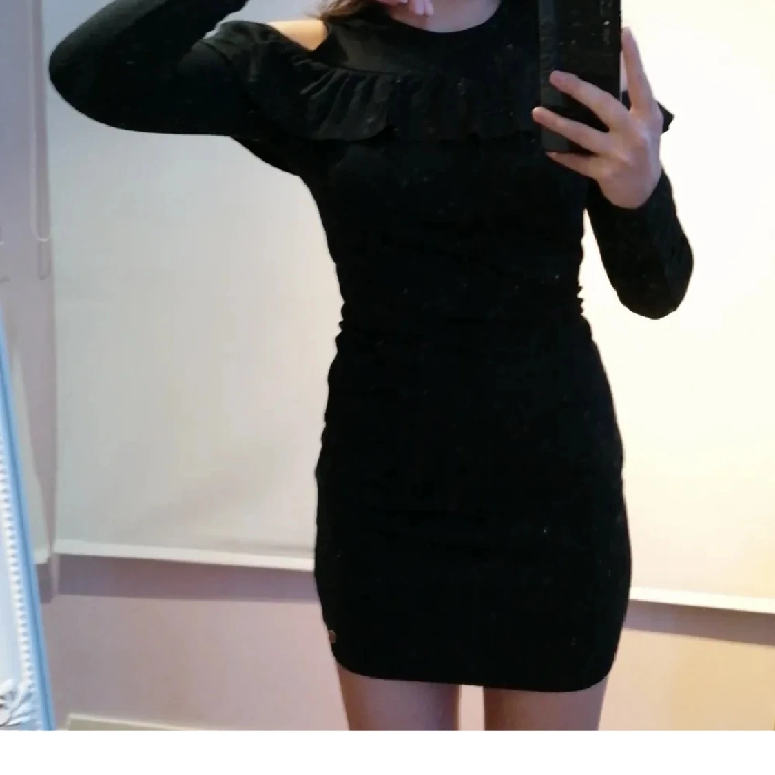 Svart långärmad klänning