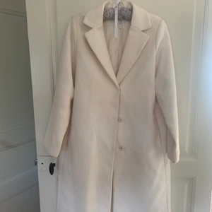 Kappa - Varm & skön vit kappa från H&M