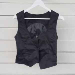 Black Waistcoat - Cropped Black Waistcoat, I like it a lot but I've bought more so I don't need this one anymore.