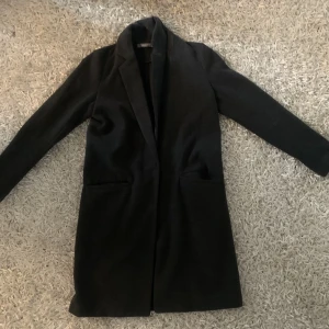 Grå kappa från Gina-tricot - Väl använd men fortfarande i gott skick