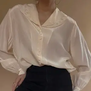 Vintage Silk Top  Embroidered Collar with Silver Trim  Cufflinking Sleeves, Cufflinks Sold Separately  Cream Color  Hand Wash Cold  Best Fits S/M  24 CM/ 9.4 IN Length, 23.5 CM/ 9.3 IN Sleeve, 84 CM/ 33.1 IN Chest, 82 CM/ 32.3 IN Waist