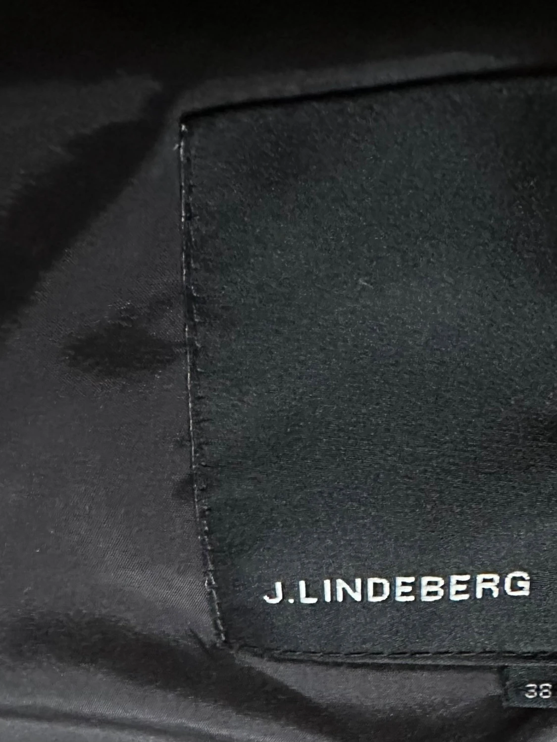 Svart kappa från J.Lindeberg - 2